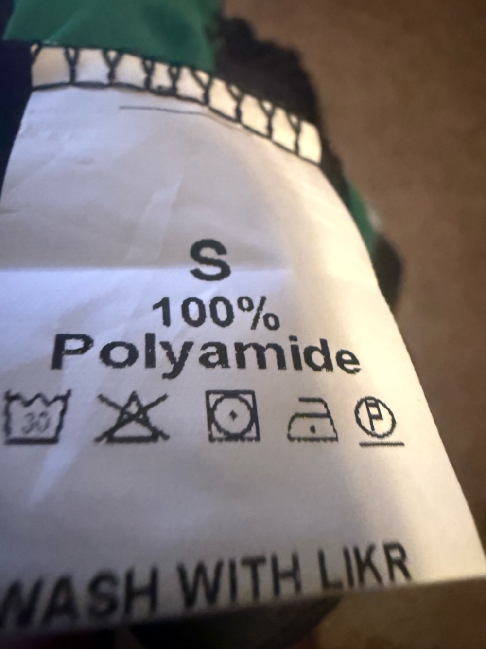 100% Polyamide Garment Tag - Size S - Black & Green